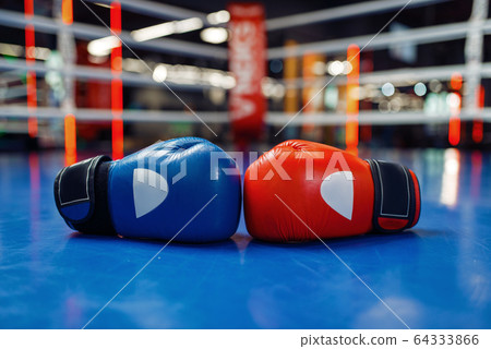 Pair of leather boxing gloves on ring, nobody Pair of leather boxing gloves on ring, nobody 64333866