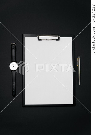 Clean white sheet of paper with free copy space, laptop, watch and pen on black backgroun. Clean white sheet of paper with free copy space, laptop, watch and pen on black backgroun. 64334238