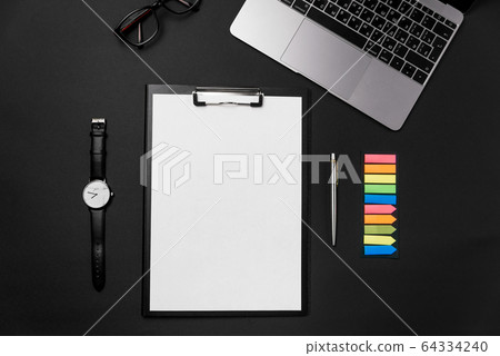 Clean white sheet of paper with free copy space, laptop, watch and pen on black backgroun. Clean white sheet of paper with free copy space, laptop, watch and pen on black backgroun. 64334240