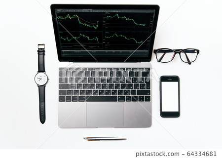 Top view white office desk with laptop, smart phone and supplies, flat lay. 64334681