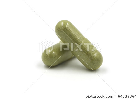 Andrographis paniculata pill capsule in green on Andrographis paniculata pill capsule in green on 64335364