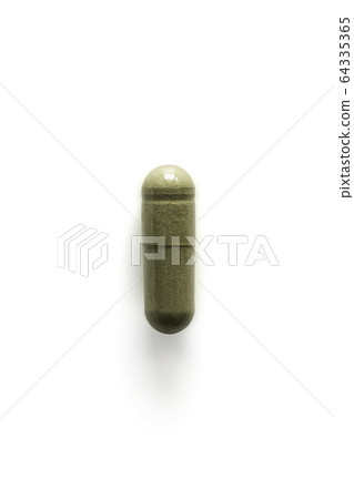 Andrographis paniculata pill capsule in green on 64335365