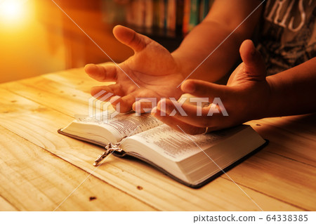 Christian hand while praying and worship for Christian hand while praying and worship for 64338385