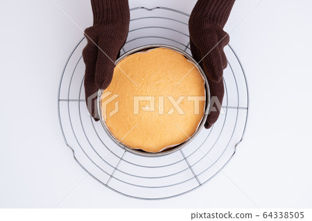 Making sweets at home, making sponge dough, freshly baked sponge dough, overhead view Making sweets at home, making sponge dough, freshly baked sponge dough, overhead view 64338505