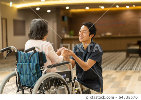 Nursing care facility senior caregiver doctor medical image Nursing care facility senior caregiver doctor medical image 64338570