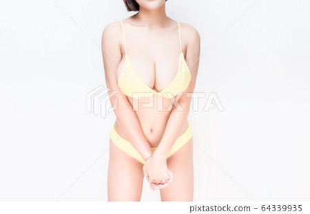 Close up of female big natural breasts. Isolated 64339935