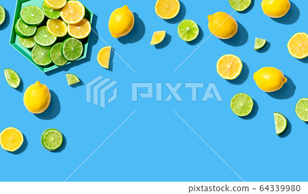 Fresh lemons and limes overhead view 64339980