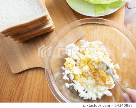 Sandwich making Egg salad making 64340985
