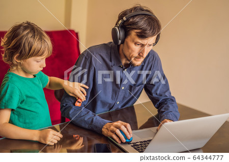 Man is trying to work from home because of the coronovirus epidemic, but his son is stopping him 64344777
