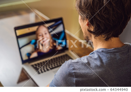 Man and woman are talking through a video call 64344940