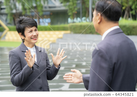 Old asian business people greeting togather by new 64345821