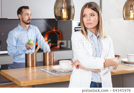 Upset girl after discord with man 64345976