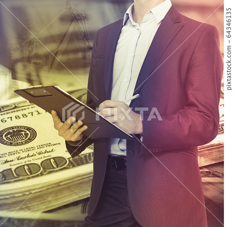 Businessman on money background 64346135