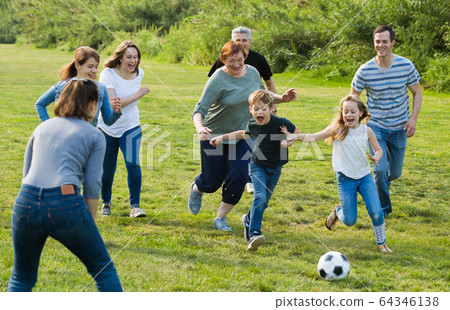 people of different ages playing football people of different ages playing football 64346138