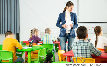 Teacher controlling learning process in primary school Teacher controlling learning process in primary school 64346219