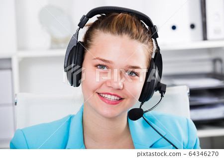 Portrait of dispatcher female which is talking with client Portrait of dispatcher female which is talking with client 64346270