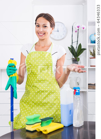 woman wiping surfaces home 64346333