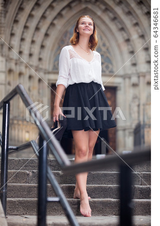 young female going barefoot the stone stairs 64346681