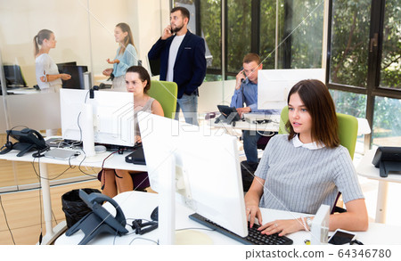Group of successful business people during daily work in modern co-working space Group of successful business people during daily work in modern co-working space 64346780
