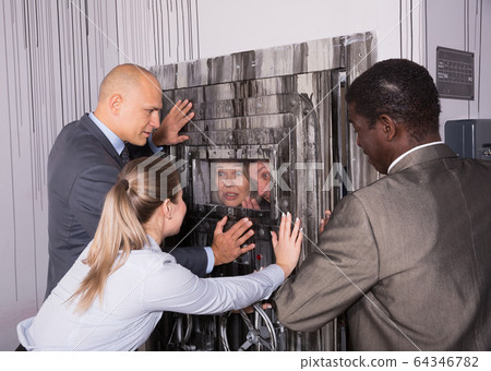 People solving puzzles in escape room People solving puzzles in escape room 64346782