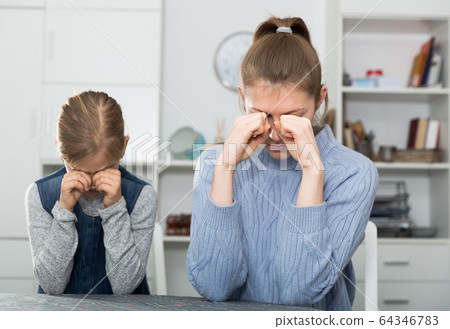 Crying mother and her daughter Crying mother and her daughter 64346783
