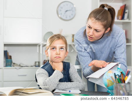 Mother scolding her daughter Mother scolding her daughter 64346785