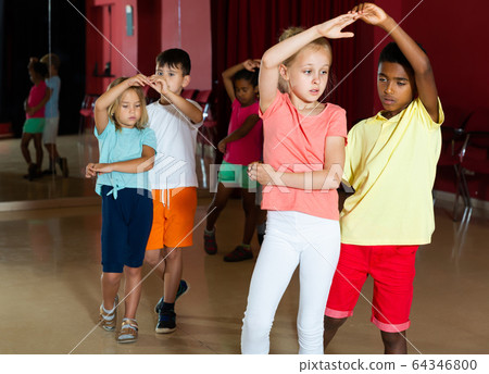 Group of nice kids dancing salsa dance Group of nice kids dancing salsa dance 64346800