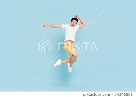 Happy handsome Asian man smiling and jumping 64346801