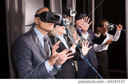 Happy man wearing VR glasses Happy man wearing VR glasses 64347157