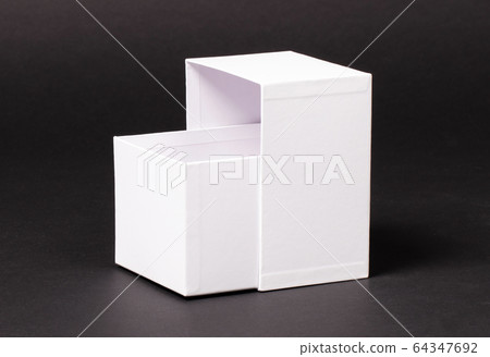 Opened blank White box on black background 64347692