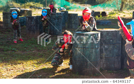 Teams of kids facing on battlefield Teams of kids facing on battlefield 64349137