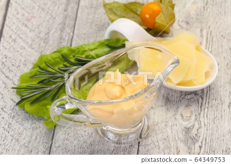 Cheese sauce in the bowl 64349753