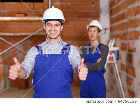 Portrait of two confident workers Portrait of two confident workers 64350159