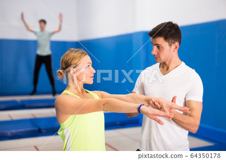 People warming up before trampoline training People warming up before trampoline training 64350178