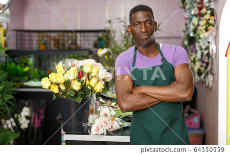Proud florist in floral shop Proud florist in floral shop 64350559