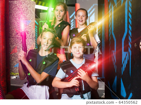 Teen kids with laser guns 64350562