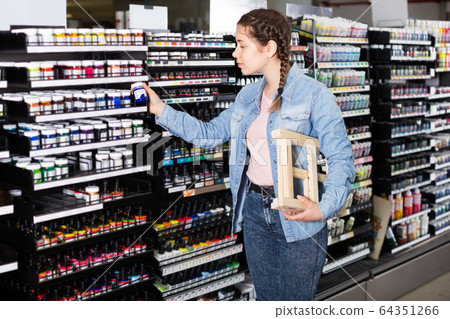 Girl shopping color in glass jar in art store Girl shopping color in glass jar in art store 64351266