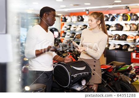 man and woman choosing dry bag for motorcycle man and woman choosing dry bag for motorcycle 64351288