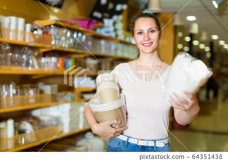 Female is making decision to buy potty for flowers Female is making decision to buy potty for flowers 64351438