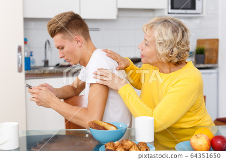 Son not paying attention to mom Son not paying attention to mom 64351650