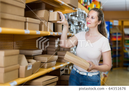 Happy adult girl with gift boxes Happy adult girl with gift boxes 64351676
