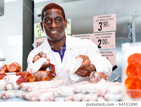 African-American man successful butcher shop owner recommending 64351890