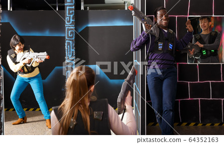 Glad international team aiming laser guns Glad international team aiming laser guns 64352163