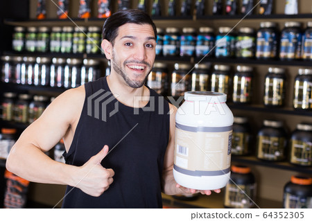 male holding thumb up and sport foods male holding thumb up and sport foods 64352305