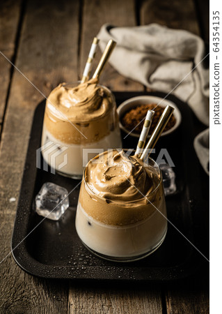 Coffee trend - dalgona coffee, whipped instant coffee Coffee trend - dalgona coffee, whipped instant coffee 64354135