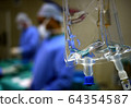 IV drip and heart monitor in hospital operating theatre 64354587