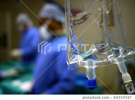 IV drip and heart monitor in hospital operating theatre IV drip and heart monitor in hospital operating theatre 64354587