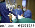 IV drip and heart monitor in hospital operating theatre 64354588