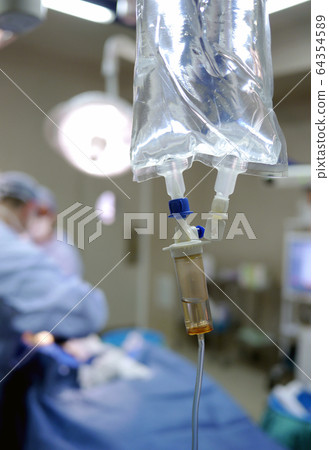 IV drip and heart monitor in hospital operating theatre IV drip and heart monitor in hospital operating theatre 64354589