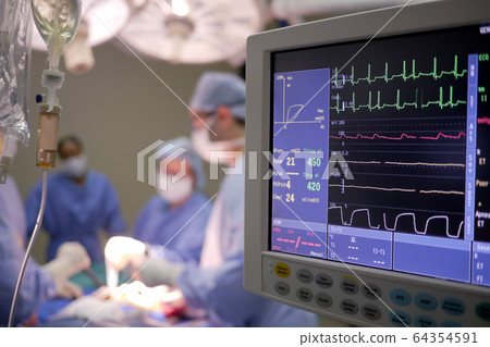 IV drip and heart monitor in hospital operating theatre IV drip and heart monitor in hospital operating theatre 64354591